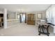 Open-concept living room featuring neutral walls, carpet, and ample natural light at 5646 Skipping Stone Dr, Indianapolis, IN 46237