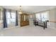 Open-concept living room featuring neutral walls, carpet, and ample natural light at 5646 Skipping Stone Dr, Indianapolis, IN 46237