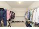 Spacious walk-in closet with ample hanging space, shelving, and organized storage for shoes and clothing at 5646 Skipping Stone Dr, Indianapolis, IN 46237