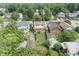 Aerial view of home with a fenced backyard and detached garage at 6051 Lowell Ave, Indianapolis, IN 46219