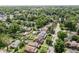 An aerial shot of a brick house in a densely populated area with mature trees at 6051 Lowell Ave, Indianapolis, IN 46219