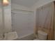 Clean and functional bathroom with a shower-tub combo, vanity sink, and natural light at 6051 Lowell Ave, Indianapolis, IN 46219