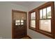 Bedroom with hardwood floors, a large window, and neutral paint at 6051 Lowell Ave, Indianapolis, IN 46219