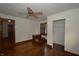 Spacious bedroom features hardwood floors, ceiling fan, and closet with wood doors at 6051 Lowell Ave, Indianapolis, IN 46219