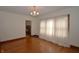 Dining area featuring hardwood floors and a doorway with trim detailing at 6051 Lowell Ave, Indianapolis, IN 46219
