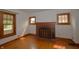 Inviting living room featuring a brick fireplace, hardwood floors, and ample natural light at 6051 Lowell Ave, Indianapolis, IN 46219