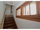 View of a staircase with wood steps and a window at 6051 Lowell Ave, Indianapolis, IN 46219