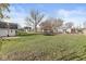 Expansive backyard view featuring a trampoline, shed, and inviting outdoor space at 617 Grovewood Dr, Beech Grove, IN 46107