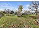 Well-maintained backyard with a trampoline and open space for outdoor activities at 617 Grovewood Dr, Beech Grove, IN 46107