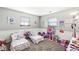This bedroom is designed for children, with two beds and a play area at 617 Grovewood Dr, Beech Grove, IN 46107