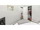 Neutral bedroom with an organized closet space and view into a play area at 617 Grovewood Dr, Beech Grove, IN 46107