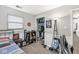 This bedroom features a closet and shelves with basketball-themed decor and a stylish chair at 617 Grovewood Dr, Beech Grove, IN 46107