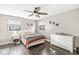 Cozy bedroom with wood floors, a ceiling fan, and natural light at 617 Grovewood Dr, Beech Grove, IN 46107