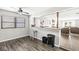 Cozy dining area features wood-look floors and an open layout leading into the living room at 617 Grovewood Dr, Beech Grove, IN 46107
