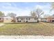 Attractive one-story home with a cozy porch and a well-maintained front yard filled with fallen leaves at 617 Grovewood Dr, Beech Grove, IN 46107