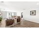 Bright living room with wood floors, neutral decor, and access to the outdoors at 617 Grovewood Dr, Beech Grove, IN 46107