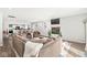 Open-concept living area with a fireplace and view of the kitchen at 617 Grovewood Dr, Beech Grove, IN 46107