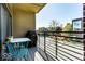 Cozy balcony area with outdoor seating and grill, perfect for enjoying the cityscape at 622 E 10Th St # 212, Indianapolis, IN 46202