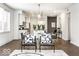 Inviting dining area with hardwood floors, modern chairs, and an open layout to the kitchen at 622 E 10Th St # 212, Indianapolis, IN 46202