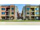 Contemporary condo building with brick facade and black iron balconies offering a modern urban living experience at 622 E 10Th St # 212, Indianapolis, IN 46202