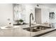 Bright condo kitchen featuring gray countertops and sleek fixtures, ideal for food preparation at 622 E 10Th St # 212, Indianapolis, IN 46202