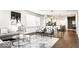 Spacious living room featuring hardwood floors, neutral color palette, and modern furnishings at 622 E 10Th St # 212, Indianapolis, IN 46202