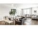 Open concept living area with modern decor, large windows, and hardwood flooring throughout at 622 E 10Th St # 212, Indianapolis, IN 46202