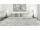 Tastefully decorated main bedroom featuring a stylish bed, modern decor, and relaxing ambiance at 622 E 10Th St # 212, Indianapolis, IN 46202