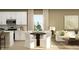Inviting dining area with a round table, stylish chairs, and seamless connection to the living room at 624 Bridgeman Rd, Avon, IN 46123