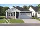 Charming single-Gathering home featuring a two-car garage and a well-manicured lawn at 624 Bridgeman Rd, Avon, IN 46123
