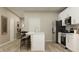 Modern kitchen featuring an island with bar stools, stainless steel appliances, and an open layout at 624 Bridgeman Rd, Avon, IN 46123