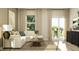 Cozy living area with a comfortable sofa, wood flooring, and access to an outdoor patio at 624 Bridgeman Rd, Avon, IN 46123