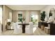 Open-concept living and dining area with hardwood floors, plenty of light, and stylish furnishings at 624 Bridgeman Rd, Avon, IN 46123