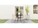 Outdoor patio area featuring a table with four chairs, ideal for relaxing or entertaining at 624 Bridgeman Rd, Avon, IN 46123