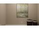 Minimalist room design with a painting, laundry bins, and neutral wall color at 624 Bridgeman Rd, Avon, IN 46123