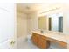 Full bathroom features a shower-tub combo, single vanity, and tiled floors at 6516 Amherst Way, Zionsville, IN 46077
