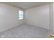 The bedroom offers carpeted floors, natural light, and a neutral color scheme at 6516 Amherst Way, Zionsville, IN 46077