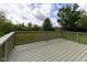 Wooden deck overlooking the backyard, ideal for relaxing and enjoying the outdoors at 6516 Amherst Way, Zionsville, IN 46077