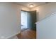 Inviting entryway with wood floors, open door, and view of the home's interior at 6516 Amherst Way, Zionsville, IN 46077
