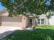 Lovely two-story home boasts an attached garage, manicured lawn, and inviting landscaping at 6516 Amherst Way, Zionsville, IN 46077