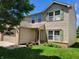 Charming two-story home featuring a well-manicured lawn, attached garage, and delightful curb appeal at 6516 Amherst Way, Zionsville, IN 46077