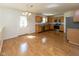 Open kitchen and dining area with stainless appliances, wood cabinets, and a stylish chandelier at 6516 Amherst Way, Zionsville, IN 46077