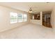 Open-concept living area showcases seamless flow into kitchen space, enhanced by natural light from multiple windows at 6516 Amherst Way, Zionsville, IN 46077