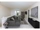 Spacious loft area with comfortable seating, stylish decor, and plenty of room to unwind at 6516 Amherst Way, Zionsville, IN 46077