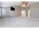 Spacious main bedroom with neutral walls, and ceiling fan, complete with ensuite access at 6516 Amherst Way, Zionsville, IN 46077