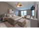 Relaxing main bedroom features vaulted ceilings, plush bedding, and a tranquil atmosphere at 6516 Amherst Way, Zionsville, IN 46077
