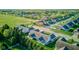 An aerial view of a neighborhood with manicured lawns and mature trees, highlighting community charm and curb appeal at 710 Monarch Ln, Lebanon, IN 46052