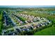 A beautiful aerial view showcases a well-maintained suburban neighborhood with lush greenery and serene landscaping at 710 Monarch Ln, Lebanon, IN 46052