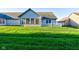 Lush green backyard and patio, perfect for outdoor activities and serene relaxation at 710 Monarch Ln, Lebanon, IN 46052