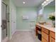 Bright bathroom features a walk-in shower, ample storage, and accessible fixtures at 710 Monarch Ln, Lebanon, IN 46052